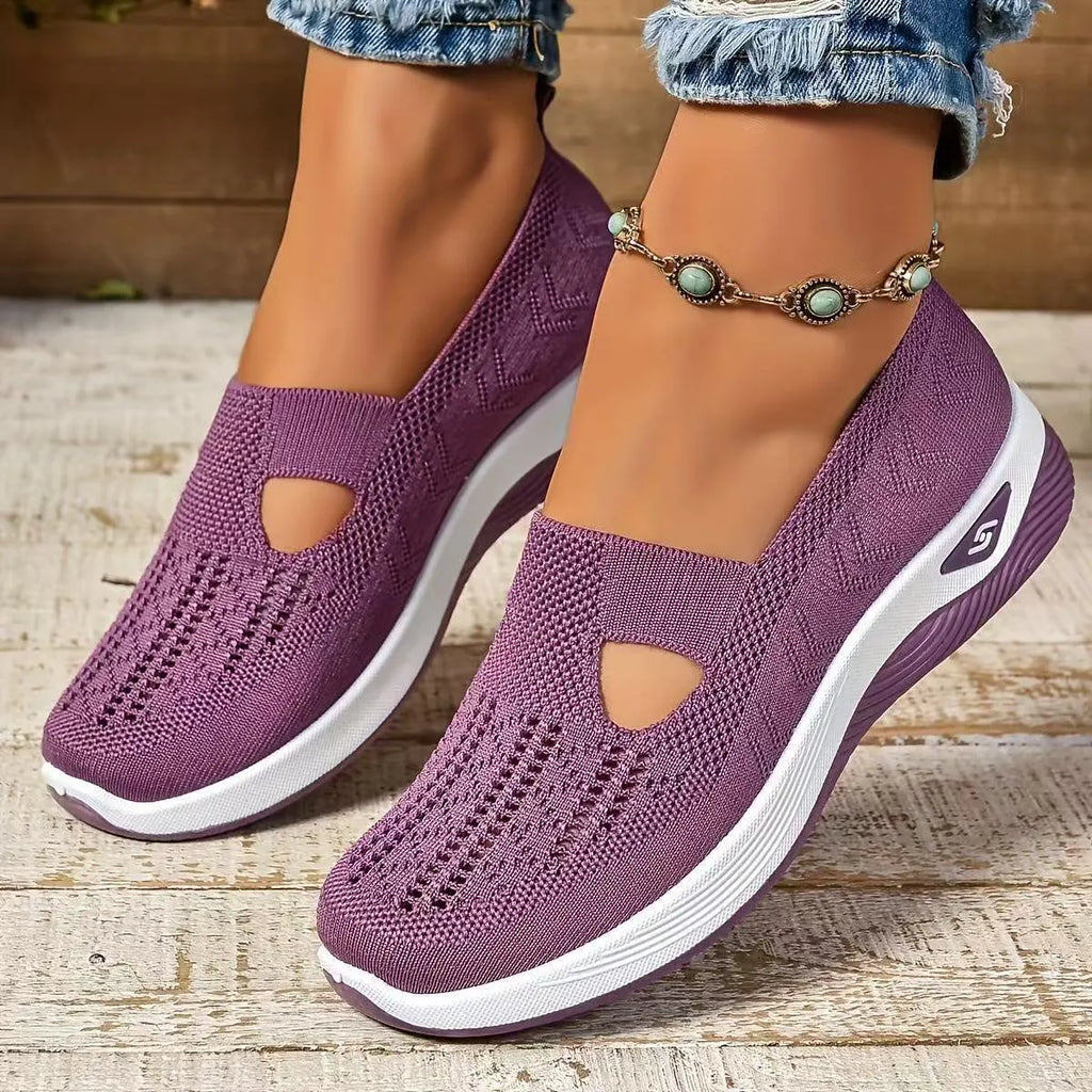 Women's black casual mesh shoes with T-strap and flat soft sole.