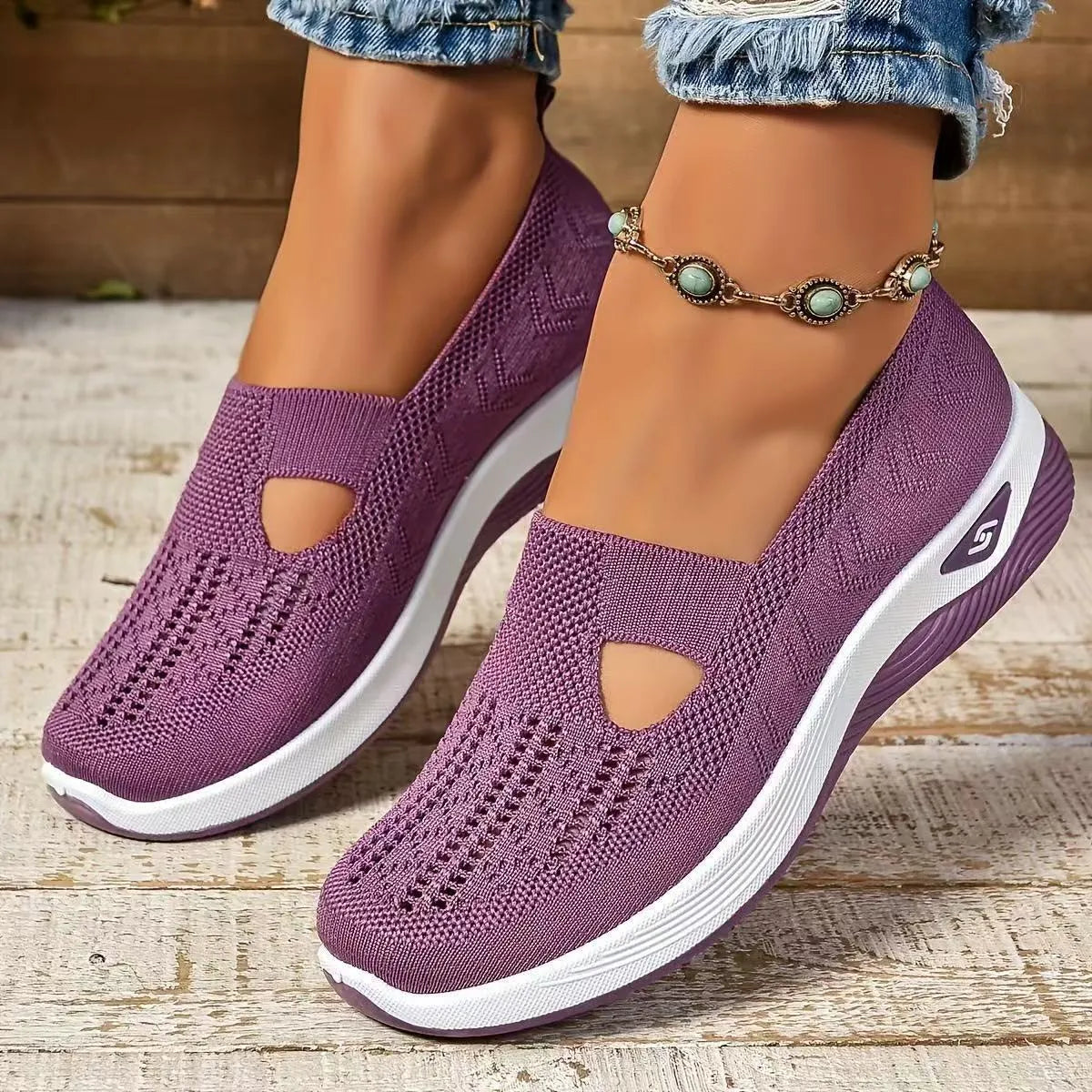 Women's black casual mesh shoes with T-strap and flat soft sole.