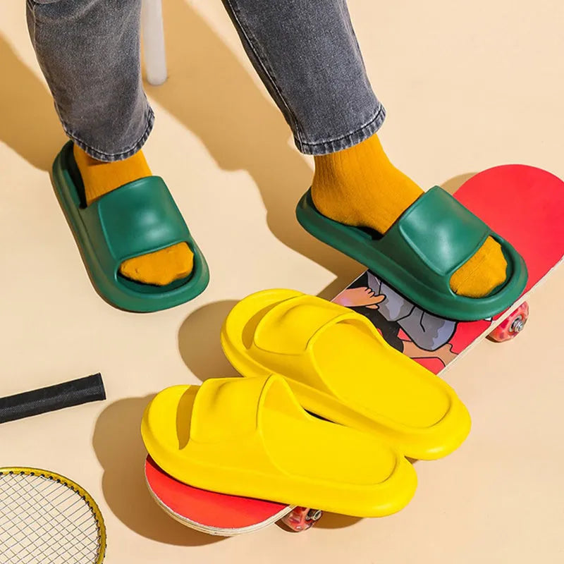 Soft EVA flip-flop slippers with thick sole in multiple colours on a white background.