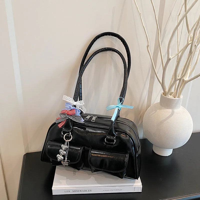 Retro pillow-shaped women's handbag in PU leather with double shoulder strap, shown in black colour