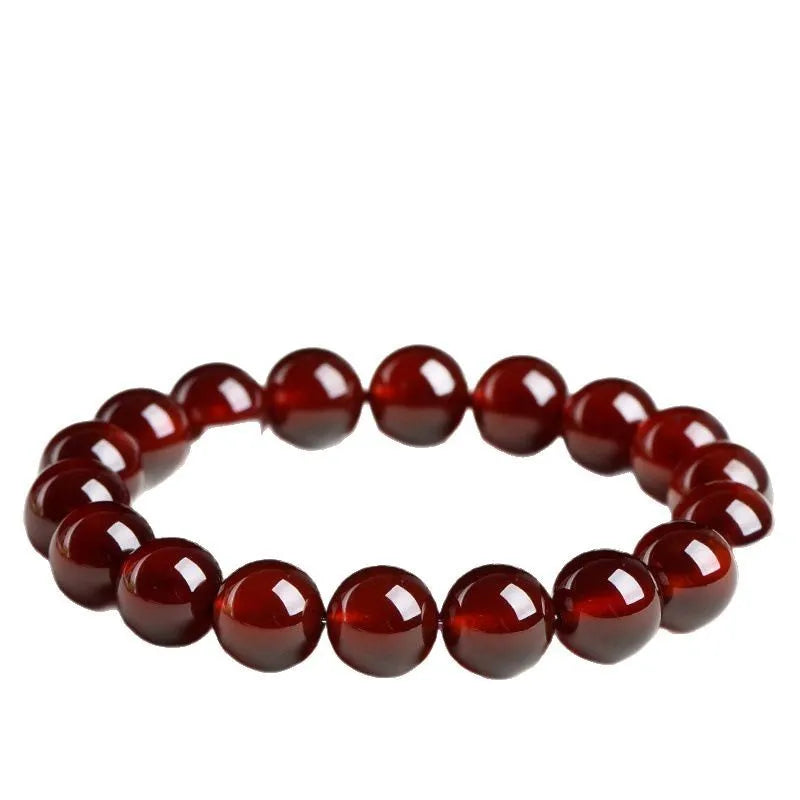Natural orange red garnet ball crystal bracelet with Ruyi design in retro unisex style.