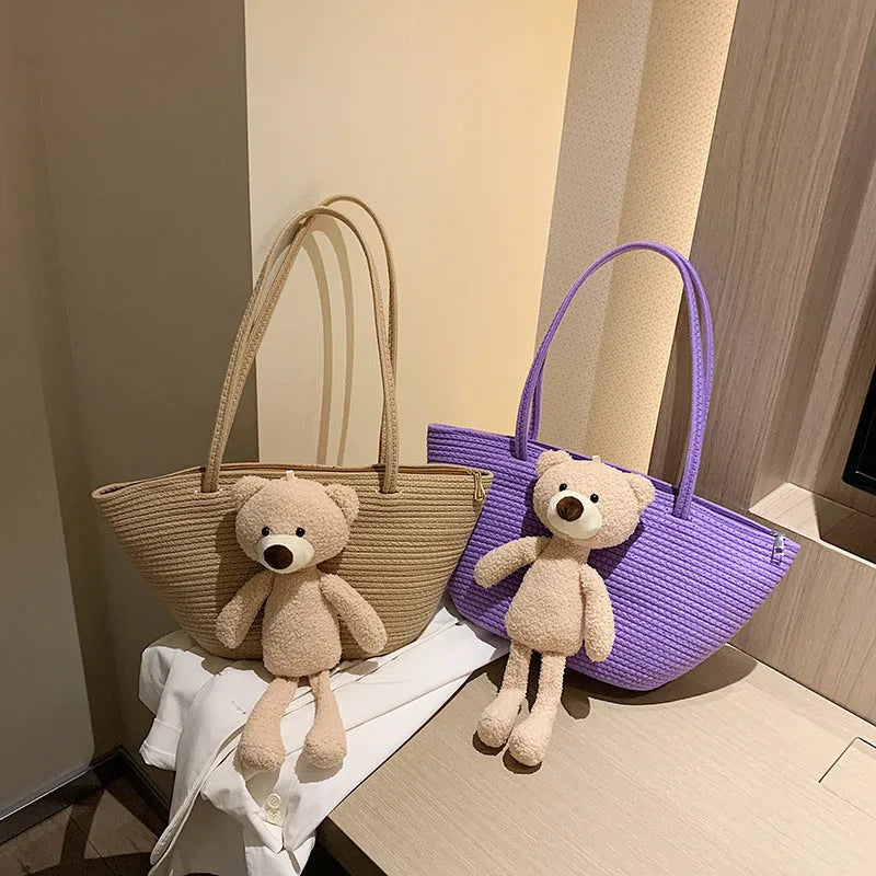 Cotton and linen woven shoulder bag in dumpling shape with three-dimensional pocket and double straps