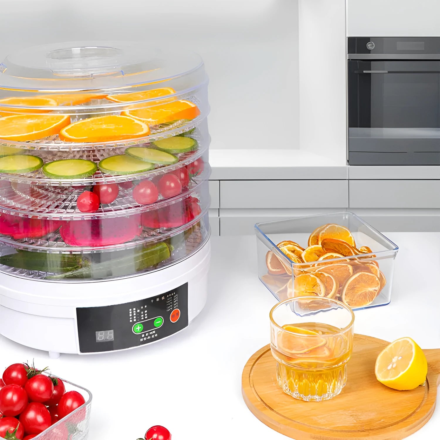 Household food dehydrator with multiple stackable drying trays on a kitchen worktop.