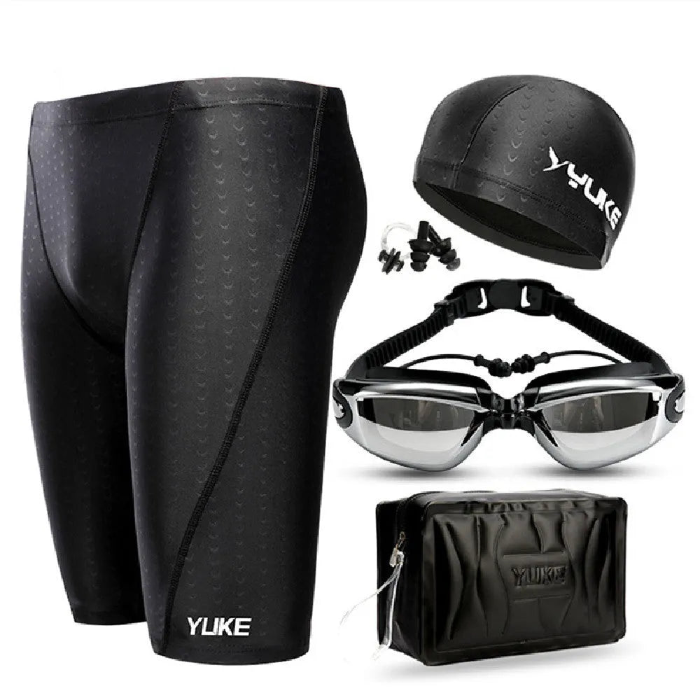 Men's black swimming set including briefs, anti-fog goggles, waterproof cap, ear plug nose clip, and carrying bag