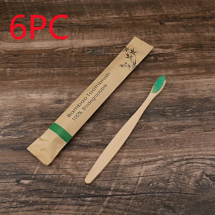 Set of 10 colourful bamboo toothbrushes with black charcoal bristles on a white background.