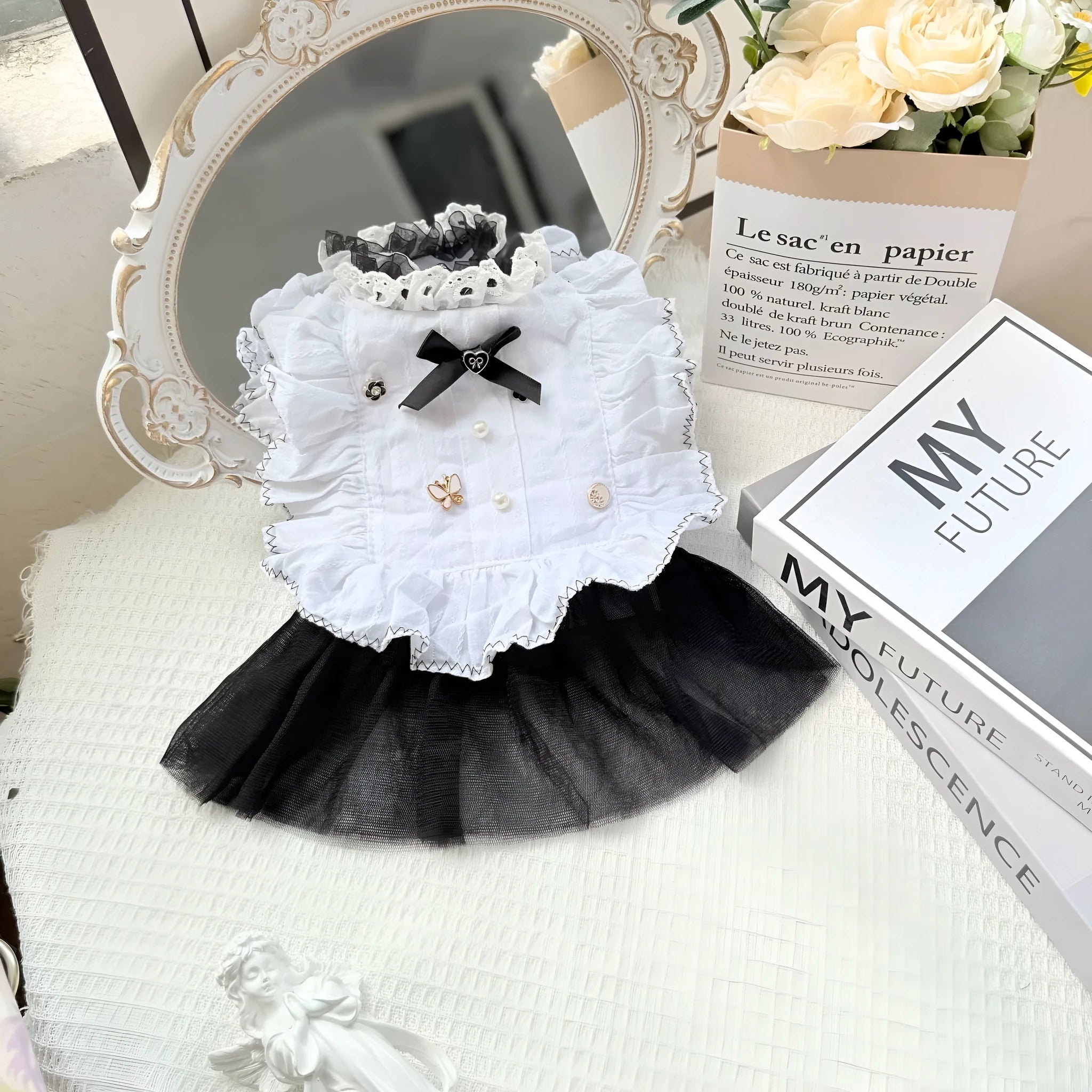 White polyester waltz gauze skirt costume on a small dog, showing princess style and lightweight fabric.