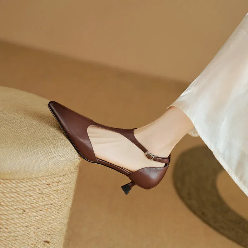 Women's vintage brown high heel shoe with a pointed toe and cowhide upper