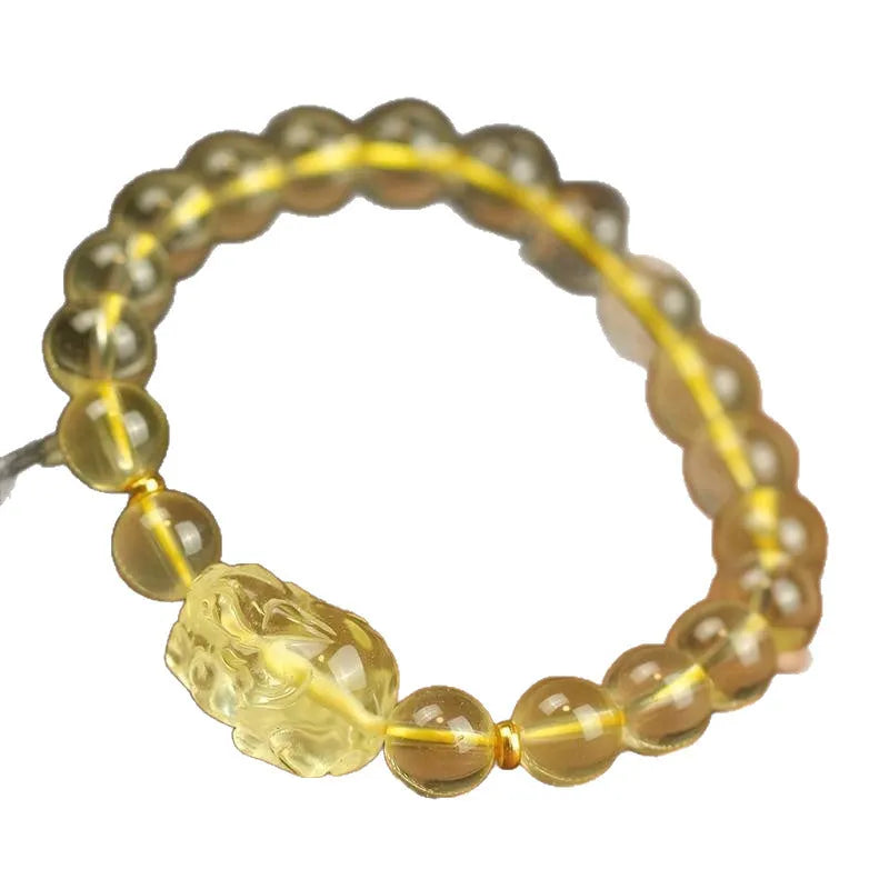 Yellow leather bracelet with an artificial citrine crystal Pi Xiu charm in Chinese national style.