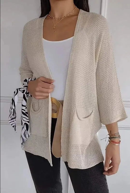 Women's thin waffle knit cardigan coat with nine-quarter sleeves and front pockets in army green.