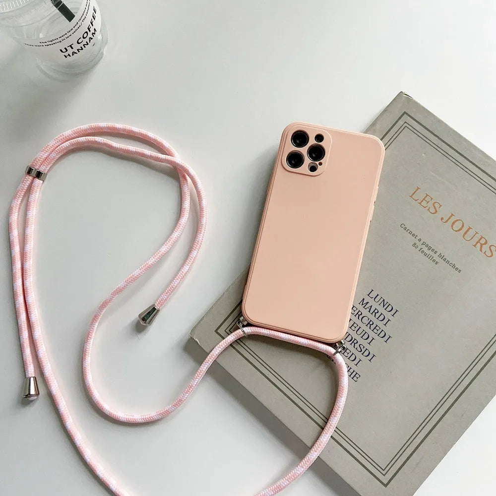Liquid silicone phone case with crossbody lanyard for iPhone 13 Pro in black, showing rear cover and attached strap