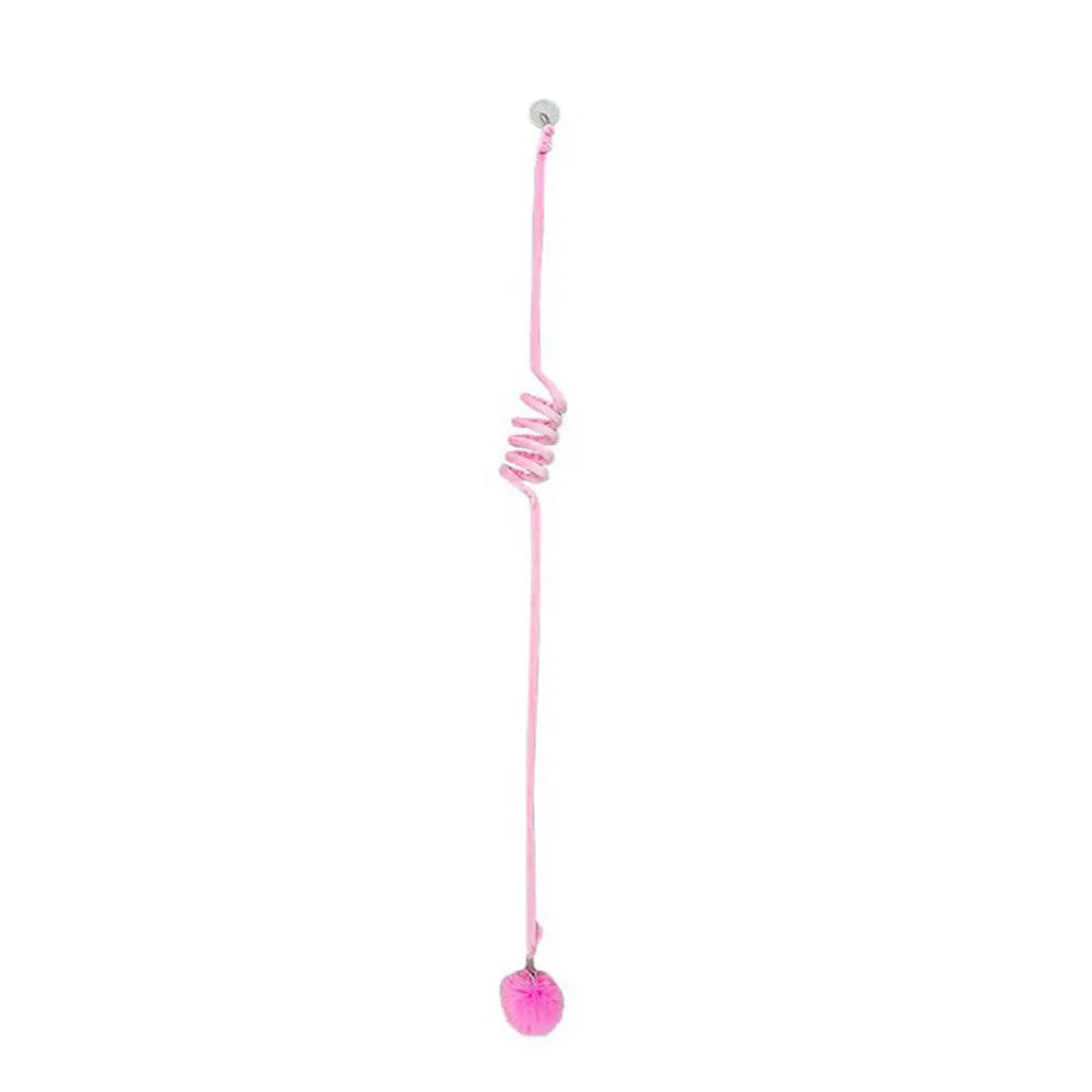 Hanging cat toy with bell stick and red inflatable ball attached to a glass door by a suction cup.