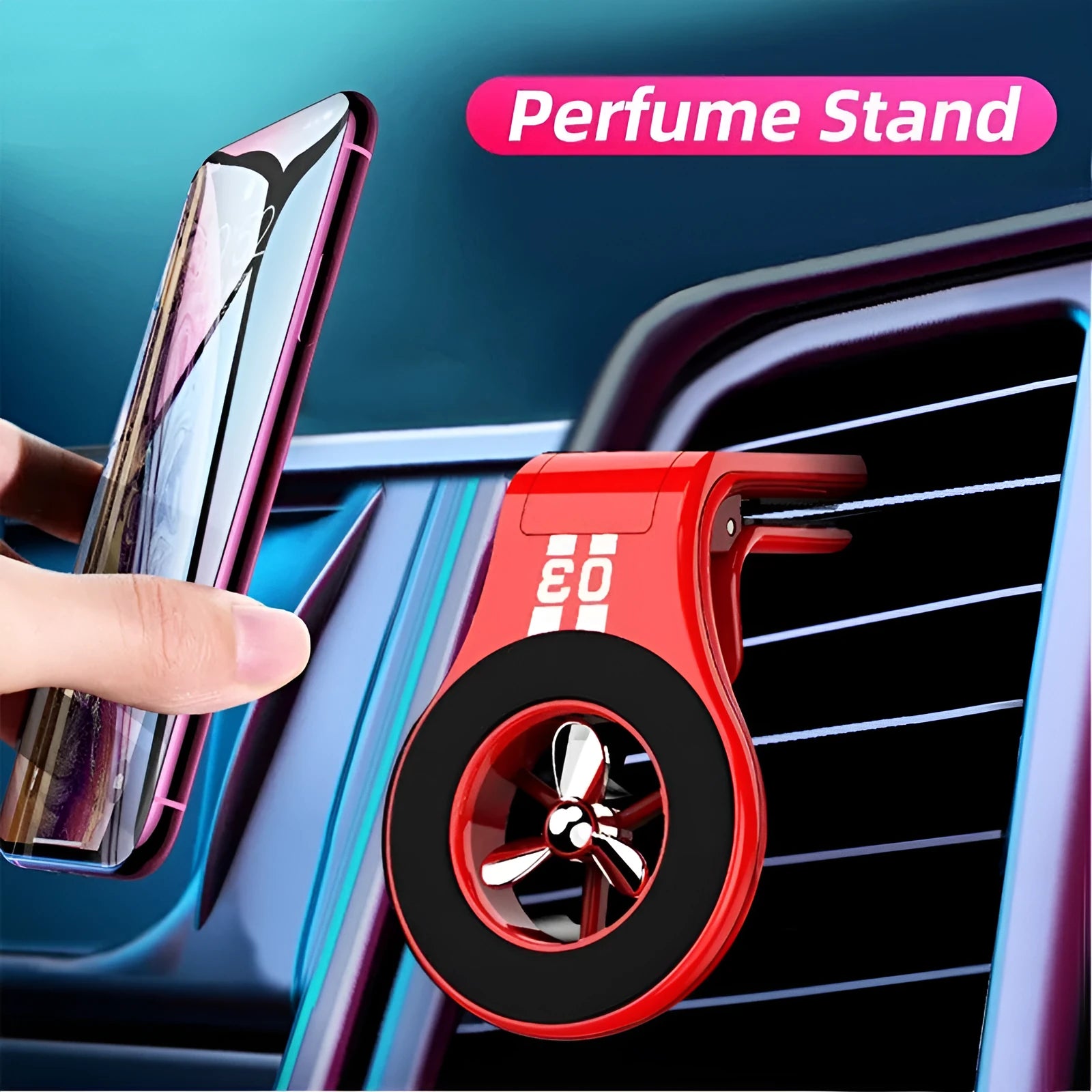 Black magnetic car phone holder clipped to a car air vent, showing adjustable paddle and fragrant slice.
