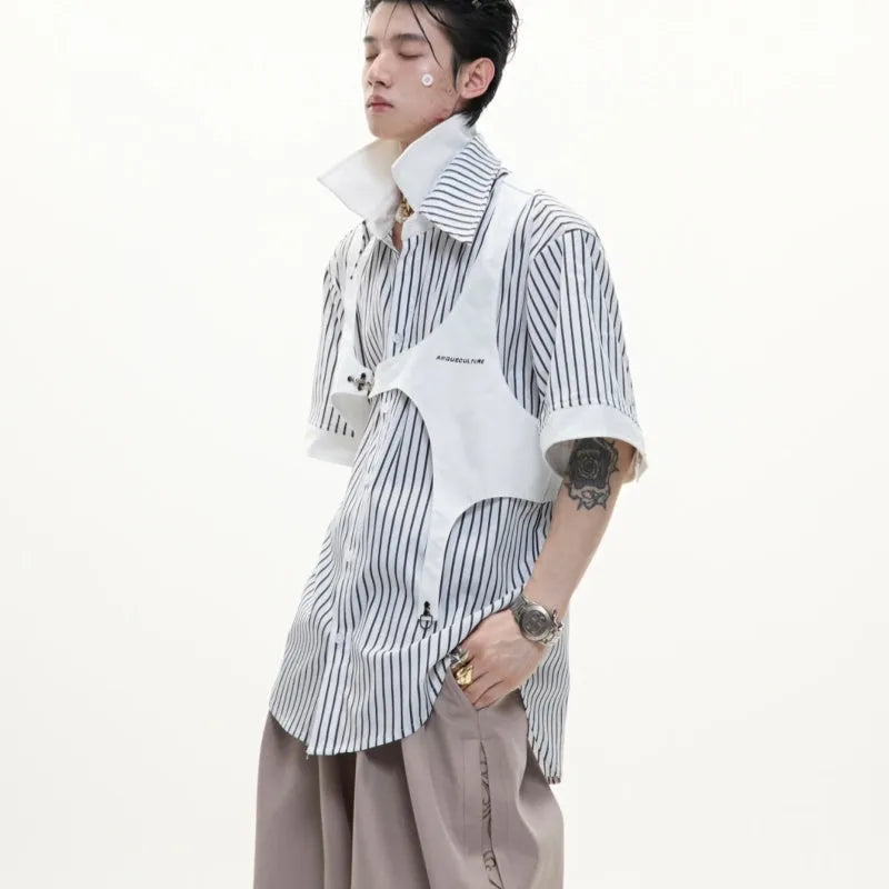 Man wearing a black and white striped cotton shirt with a distinctive double lapel collar design.