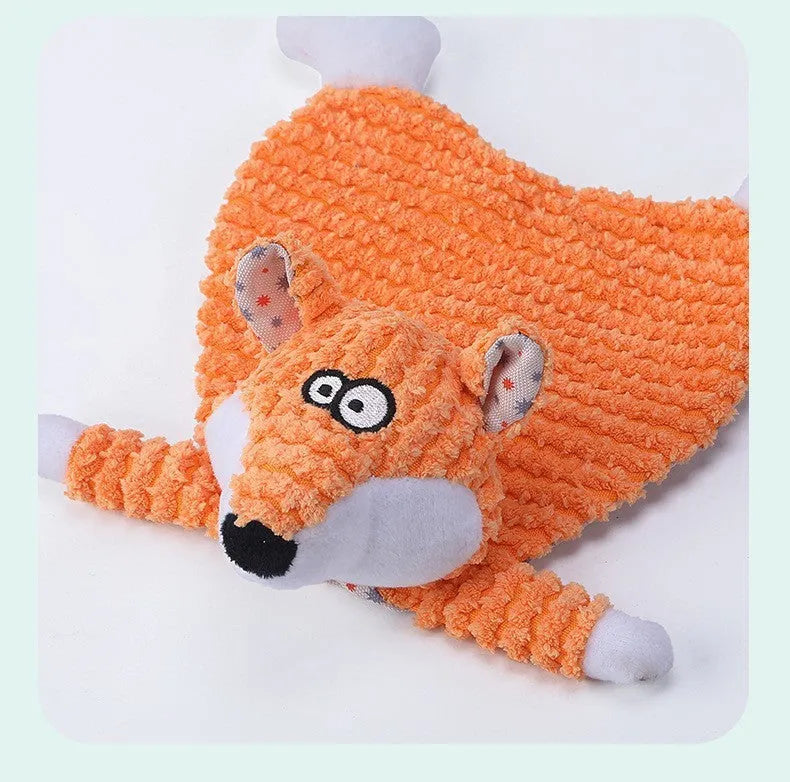 Pet stuffed toy showing fox, elephant, and dinosaur designs in brown, grey, and orange colours with soft velvet material