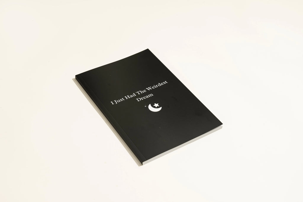 Black Dream Journal notebook with a business simplicity design for recording dreams and notes.