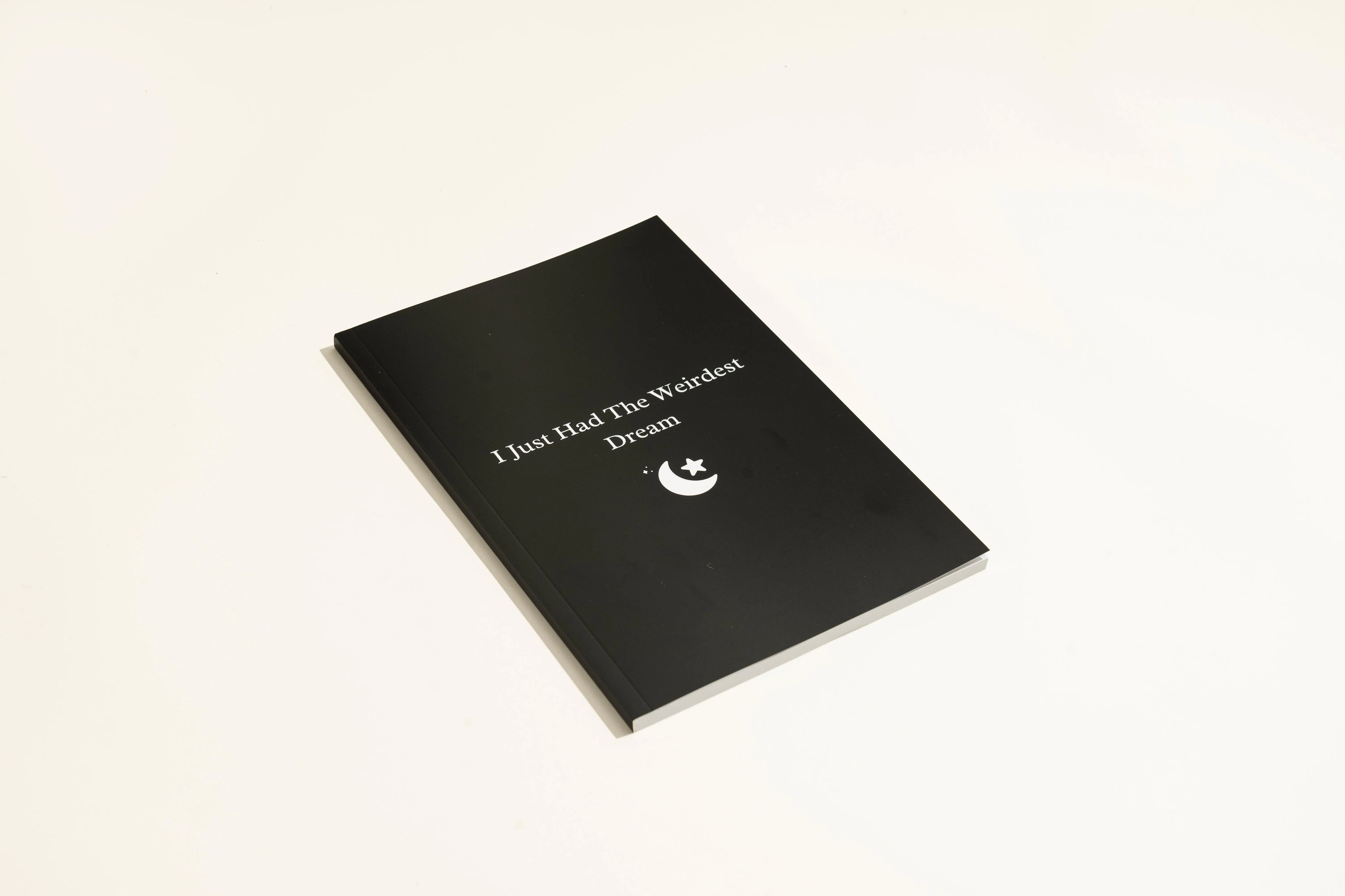 Black Dream Journal notebook with a business simplicity design for recording dreams and notes.