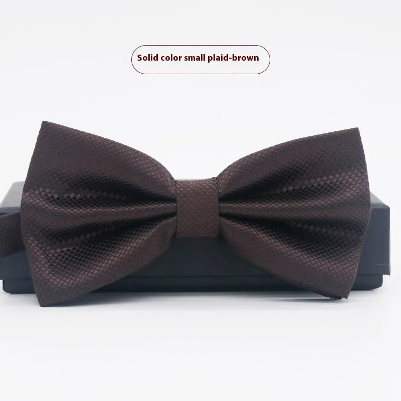 Men's flat head style polyester bow tie in a solid colour, shown with adjustable neck strap.