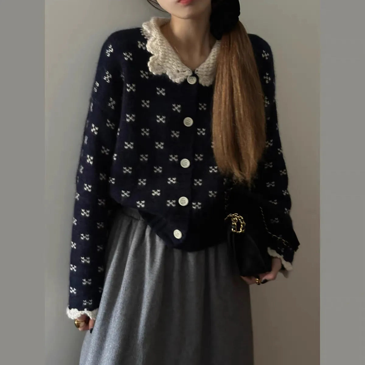 Retro floral patterned knitted cardigan coat with a Peter Pan collar and button front.