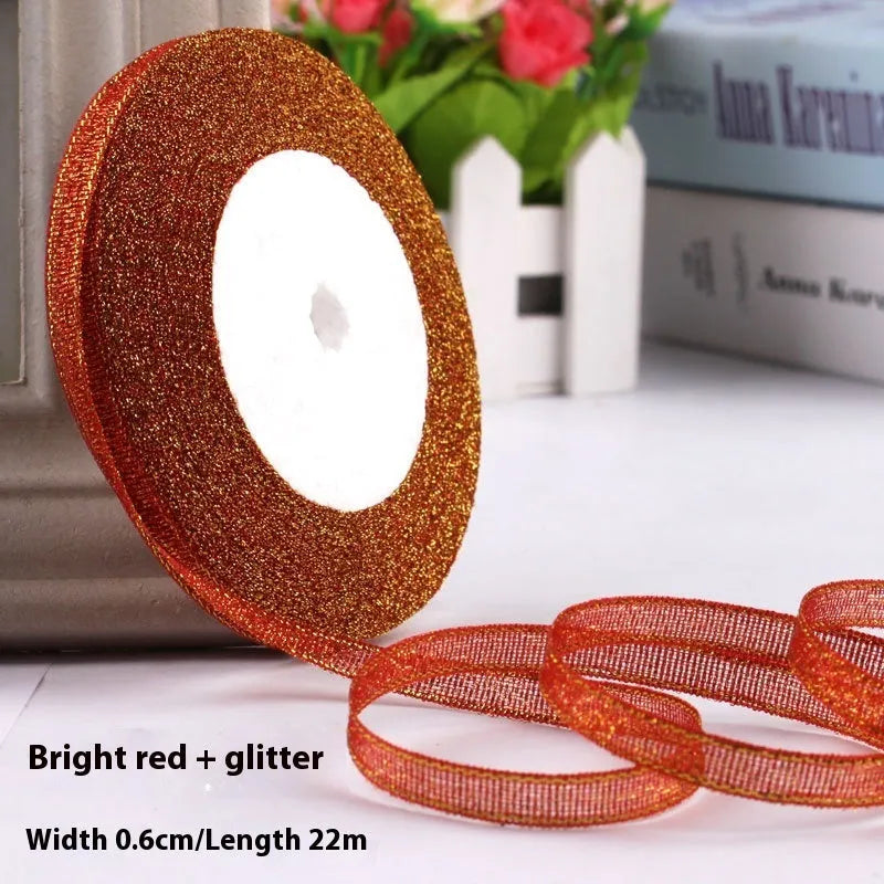 Roll of 0.6cm wide polyester gift ribbon in various colours including gold leaf, coffee and sky blue options