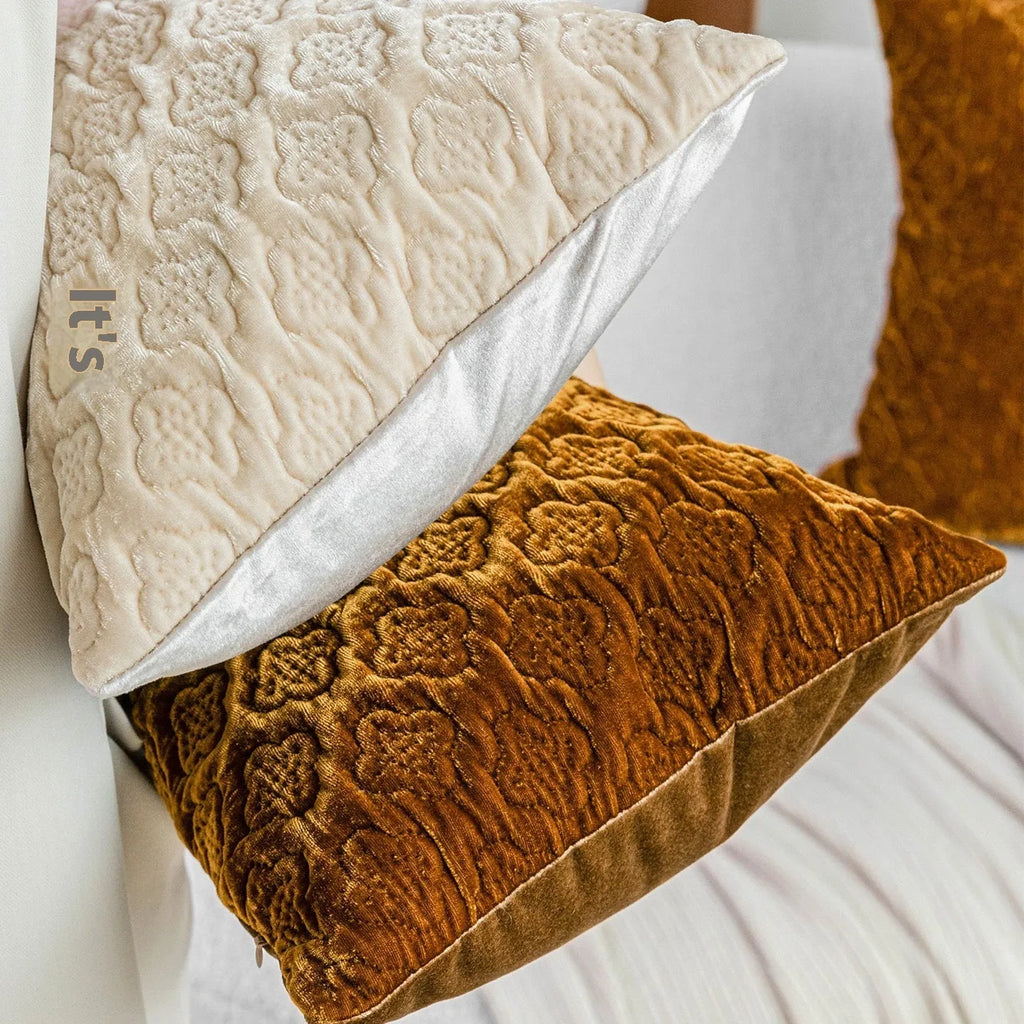 Brown gold antique style three-dimensional quilted cushion pillow on a sofa.