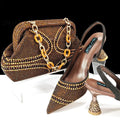 Women's pointed toe high heels with rhinestone details and matching small bag in synthetic leather
