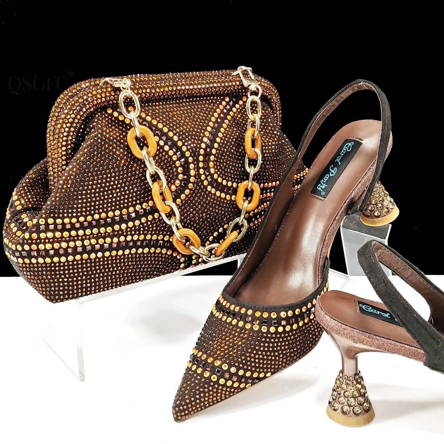 Women's pointed toe high heels with rhinestone details and matching small bag in synthetic leather