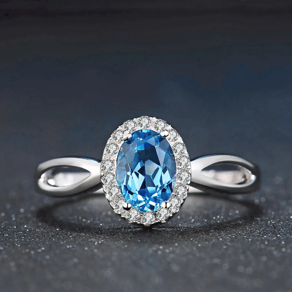 925 sterling silver jewellery set with blue topaz stones including geometric earrings, necklace, ring and pendant