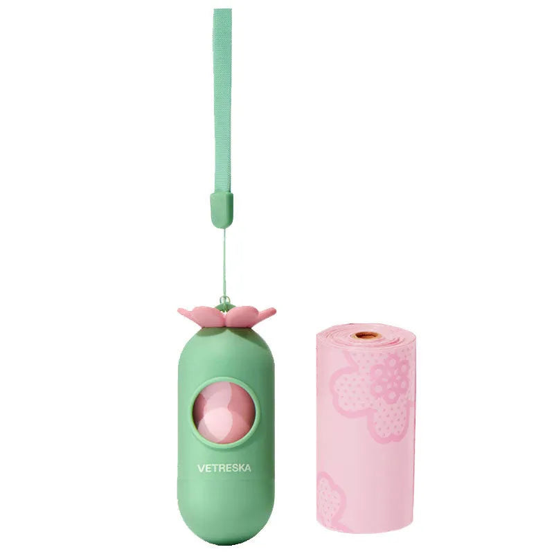 Dog waste bag dispenser capsule with a roll of scented bags in strawberry, orange, or cherry blossom design.