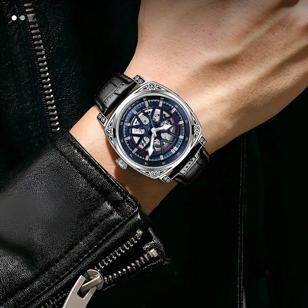 Men's stainless steel automatic watch with blue leather strap showing analogue dial