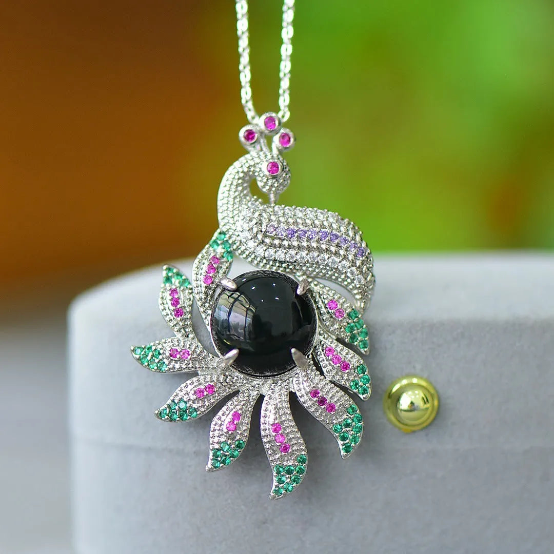 Flat grey Hetian Jade pendant with copper inlay and blue jadeware detail on a silver chain.