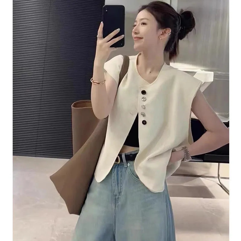 Women's polyester vest in milky white with pocket detail and loose fit design