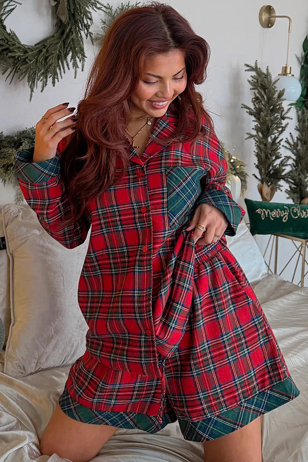 Red Christmas pyjama set with plaid contrast patches showing long sleeve shirt and matching shorts