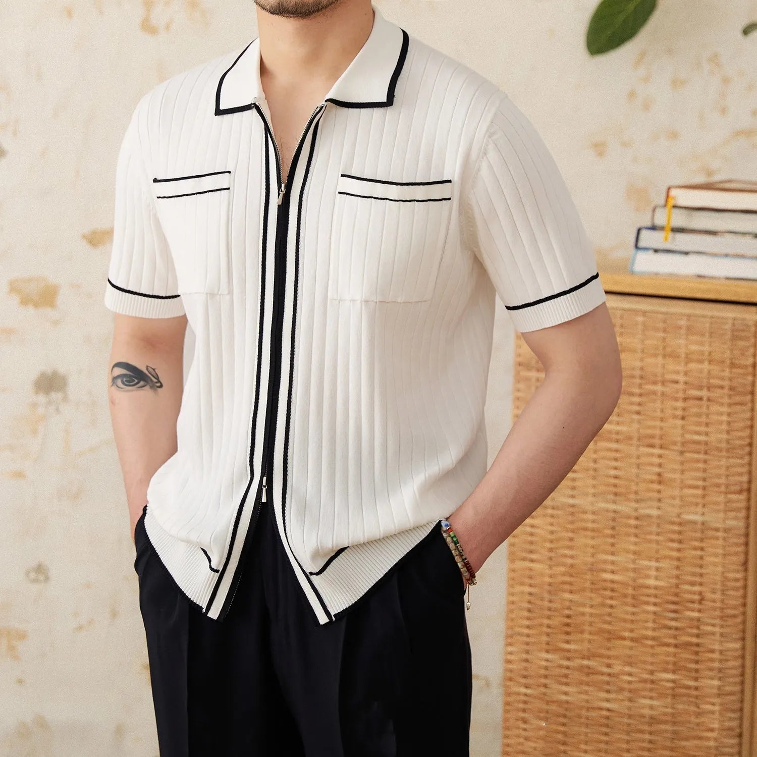 Men's slim-fit black lapel polo shirt with short sleeves made from elastic viscose blend knit fabric.