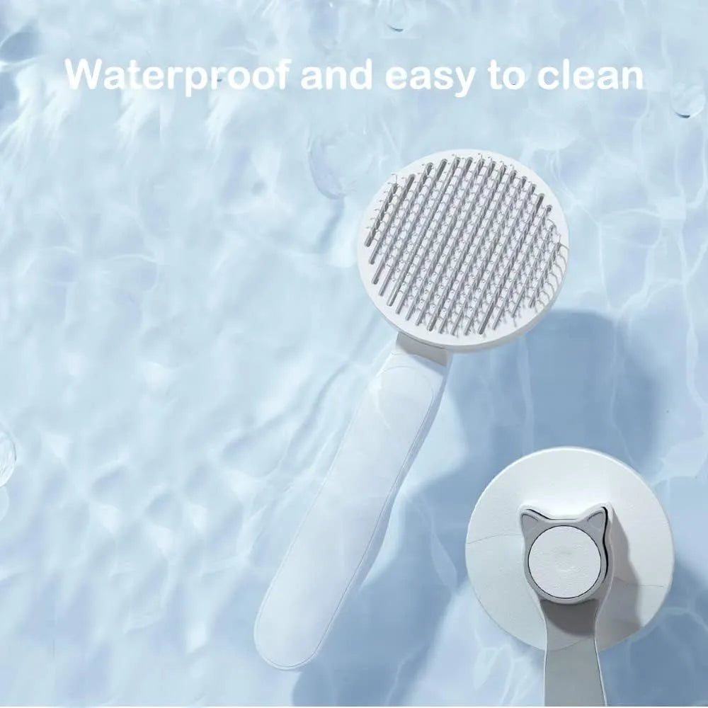 Blue self-cleaning cat brush with rubber-tipped needles and ergonomic handle for pet grooming