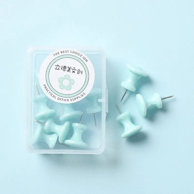 Plastic push pins in cherry blossom pink, mint green, and lavender, showing large and small sizes in a box.