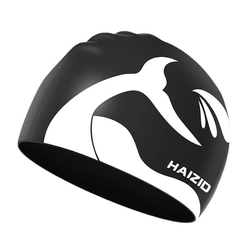 Silicone swimming cap with whale tail pattern and built-in ear protectors in assorted colours.