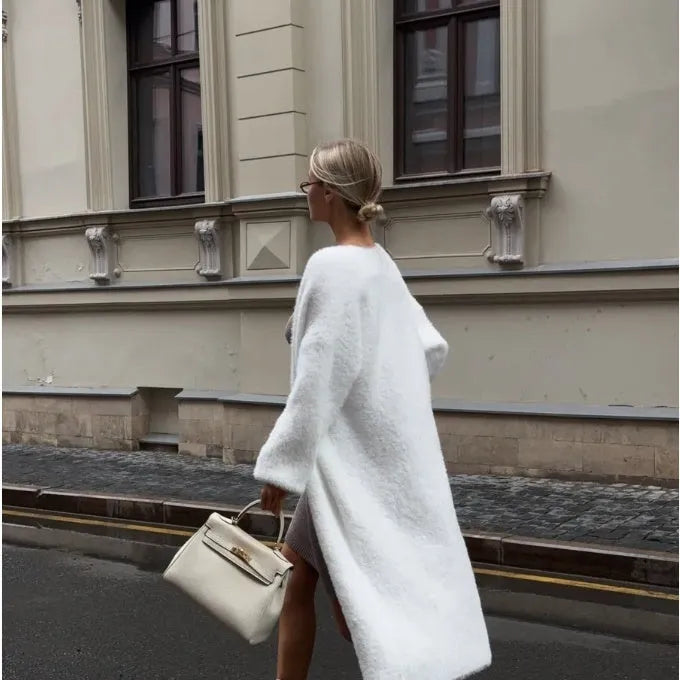 Long white women's cardigan jacket with loose fit and long sleeves.