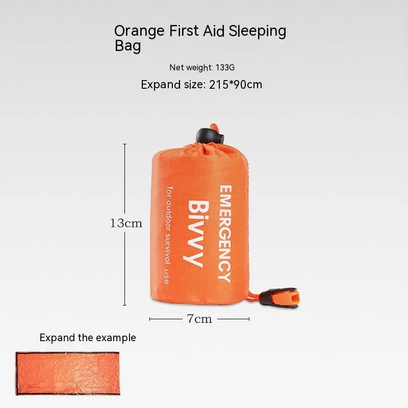 Orange emergency relief tent with sleeping bag and raincoat in temporary outdoor shelter setup