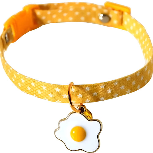 Adjustable green cat collar with a metal bell and a matching bow tie for small pets.