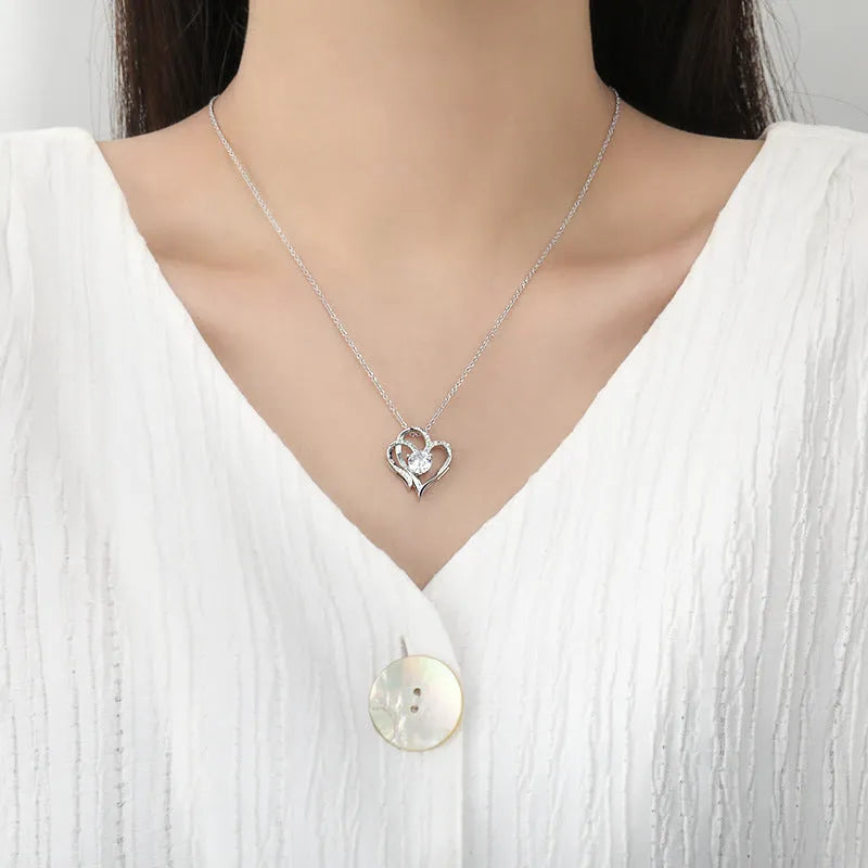 Women's silver heart necklace with choice of rose gold, white gold, or yellow gold pendant.