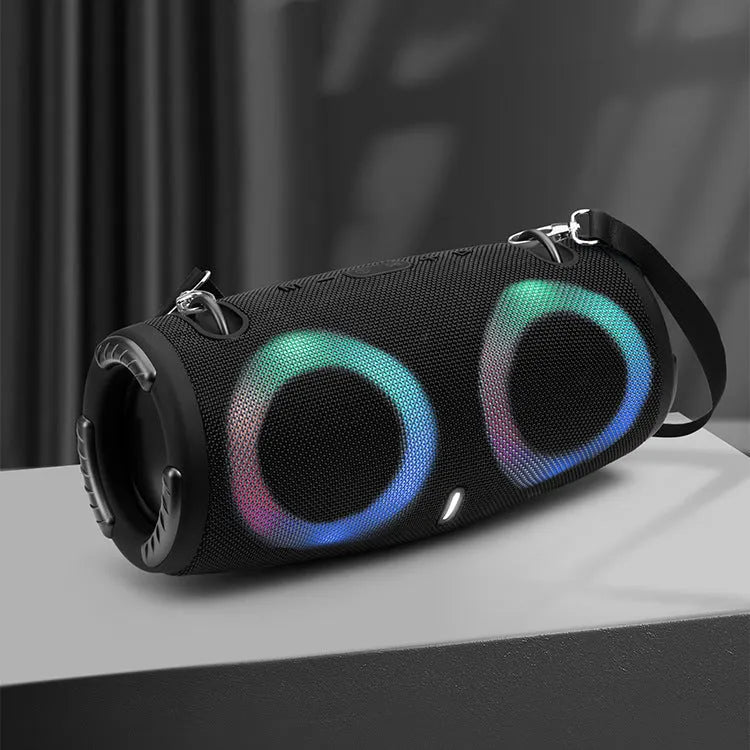 War Drum portable Bluetooth speaker with RGB coloured lights in outdoor setting