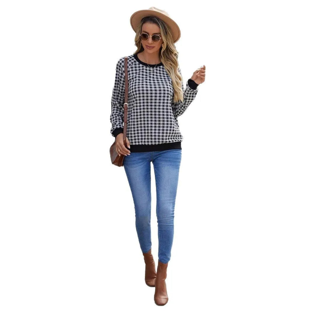 Black Japanese plaid pattern long sleeve polyester pullover sweater on a hanger