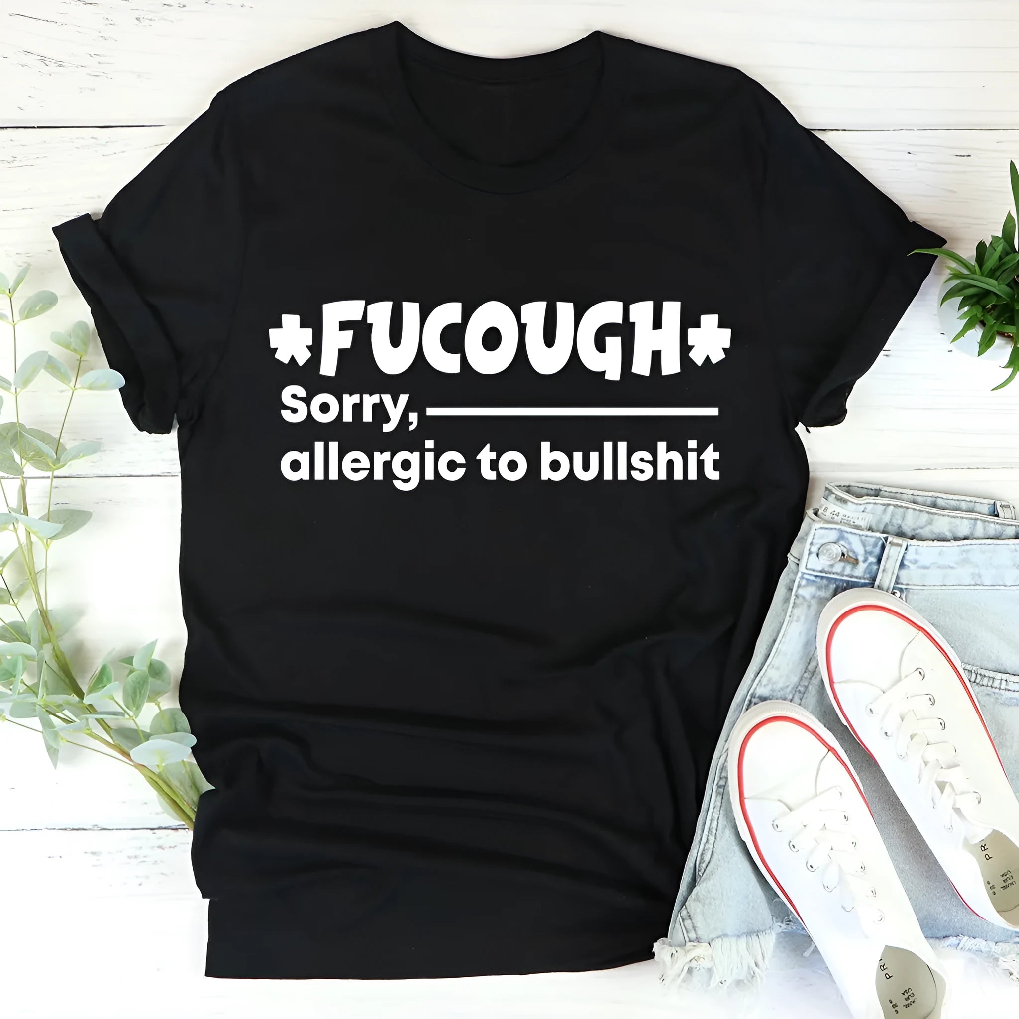 Black cotton summer T-shirt with short sleeves and round neck on hanger