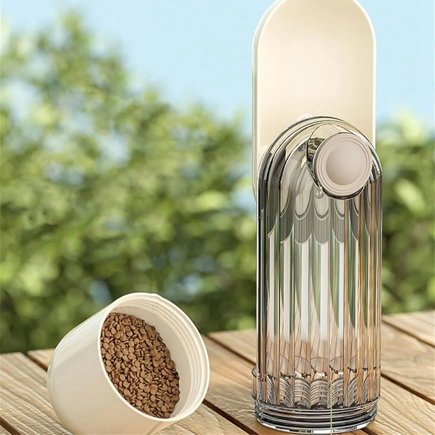 Foldable dog water bottle with food container in beige or green colour, showing drinking tray and dispenser mechanism
