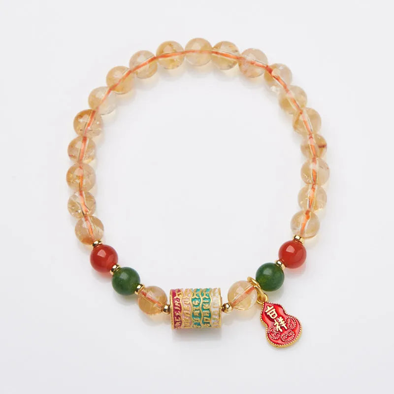 Hand-woven citrine crystal bracelet with five-sutra geometric pattern showing 6mm bead size