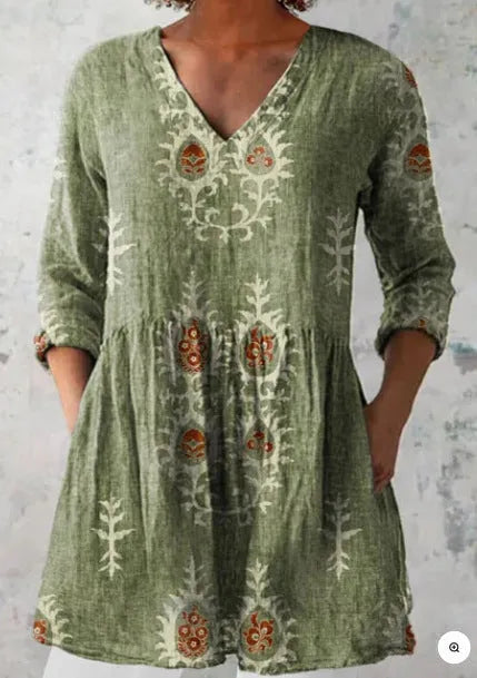 Women's long loose dress with a blue and white wave print pattern, featuring three-quarter sleeves and a wide waist.