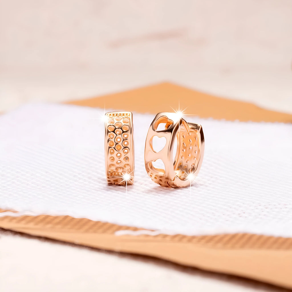 Rose gold hollow heart earrings with circular design and electroplated finish