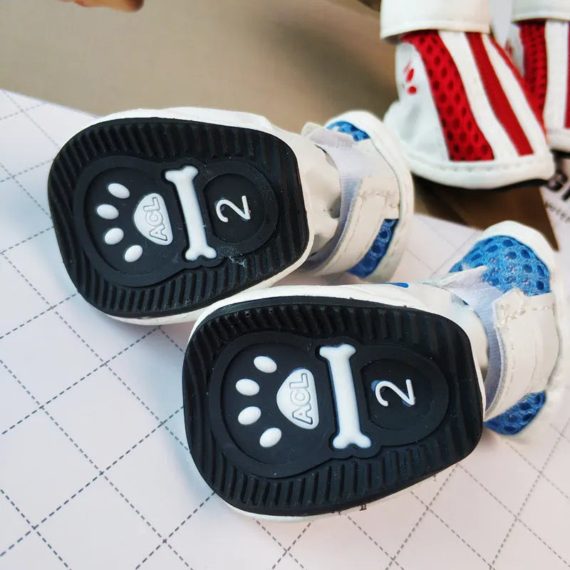 Blue zipper dog shoes with non-slip sole from a four-pair pet sneaker set.
