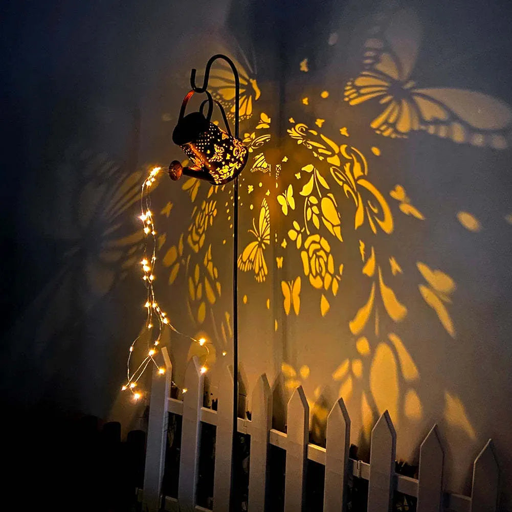 Tapered butterfly pattern iron solar garden lamp with warm white LED light.