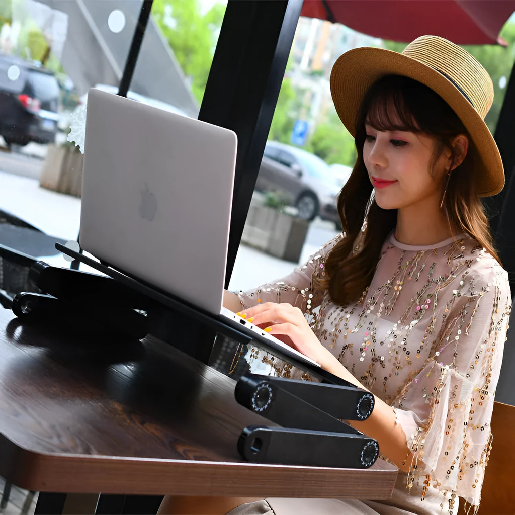 Red folding metal bed table with cooling fans and laptop surface extended